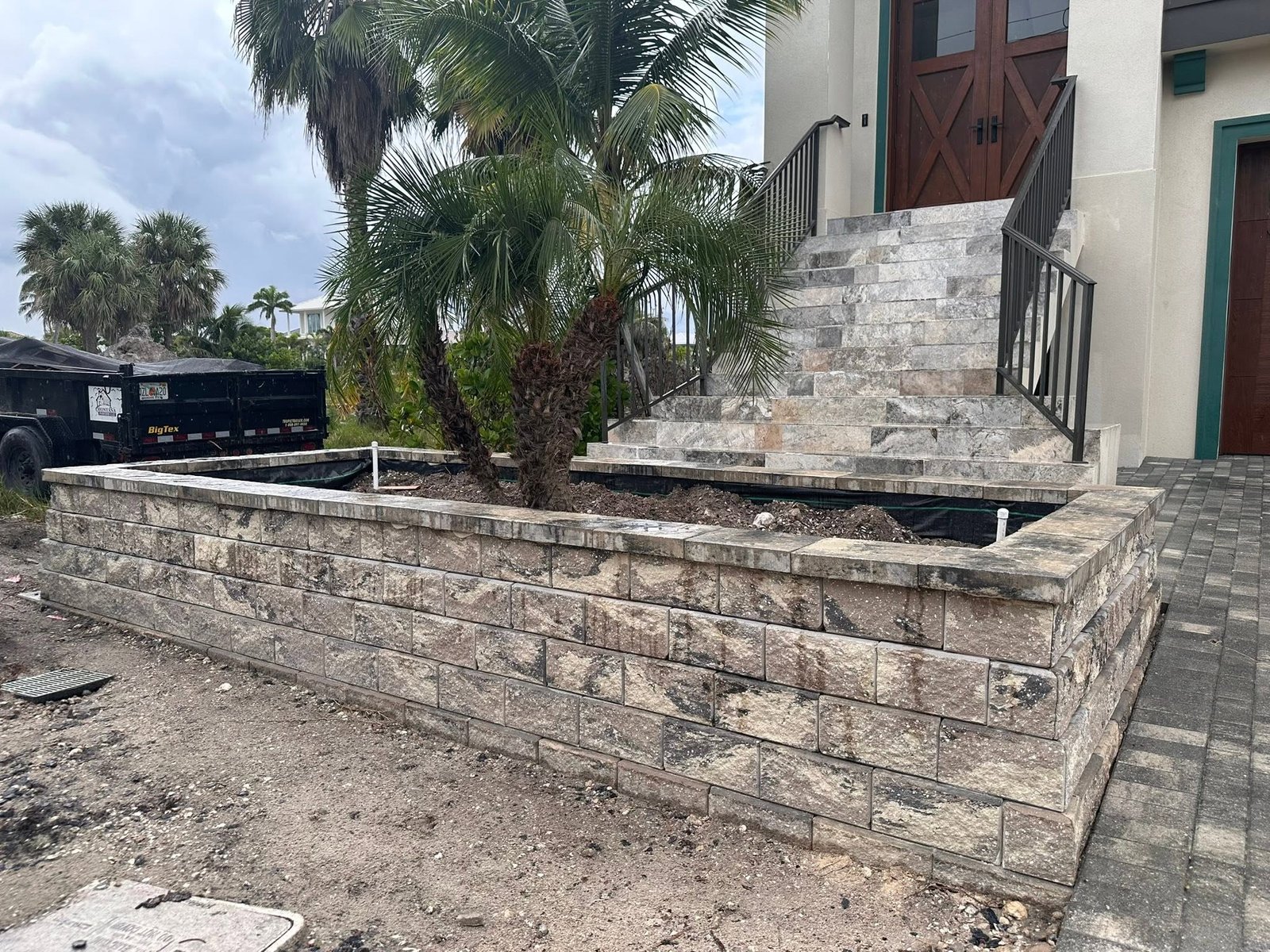 Retaining wall and planter installation